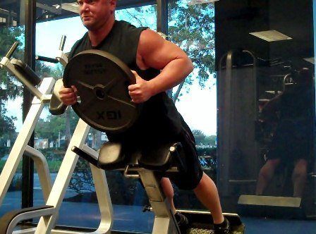 hyperextensions with 45 lb plate