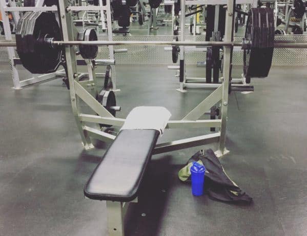 empty bench press with water bottle and gym towel