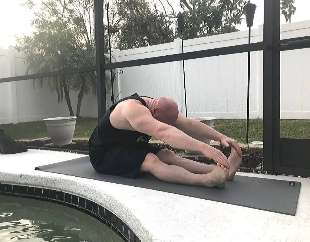 Seated toe touch to stretch hamstrings and lower back