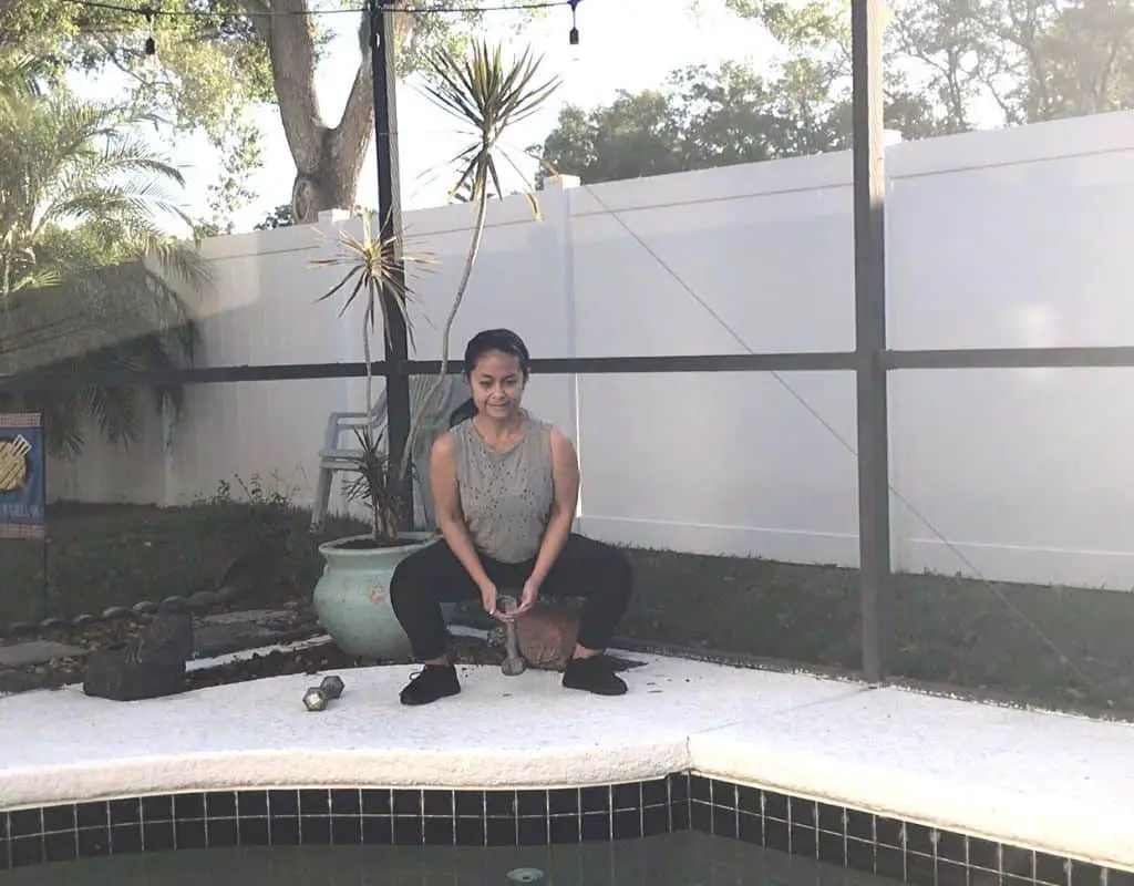 dumbbell sumo squat2 - woman