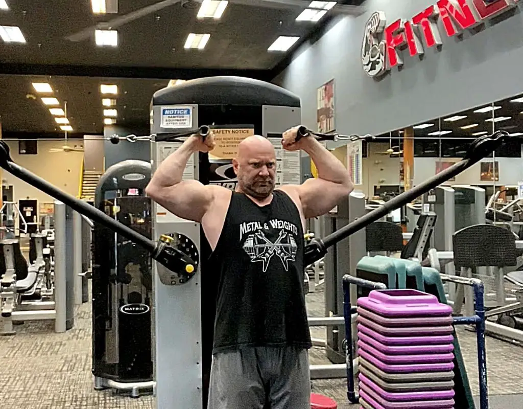 Cable pose curls biceps exercise
